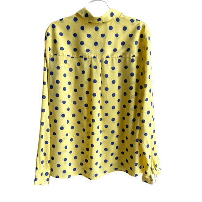 Gele blouse met blauwe bollen